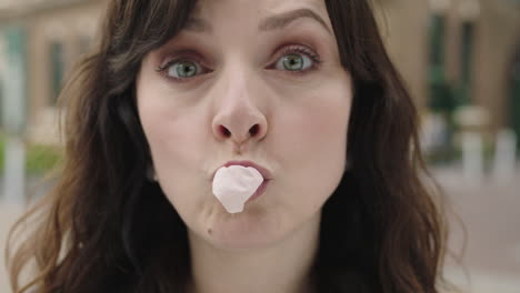 portrait of lovely elegant woman blowing bubblegum making faces happy enjoying lifestyle