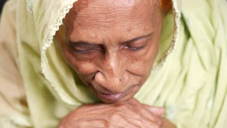 elderly woman in prayer