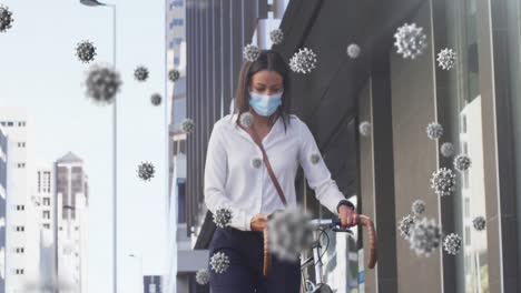 Animation-of-covid-19-cells-over-woman-walking-with-bicycle-in-city-wearing-face-mask