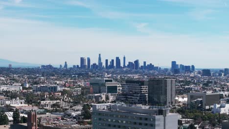 drone shot panning to the left of the la skyline in california