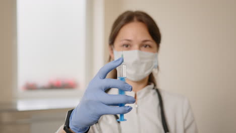 doctor holding a syringe