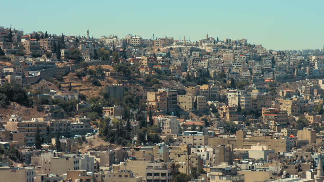 Jabal Al Ashrafyia in east Amman, Jordan. Close shot for Jabal Al Ashrafyeh. Urban Sprawl 4K footage.