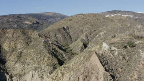 Dramatic-mountain-side-with-blue-sky-and-sharp-rock-formations