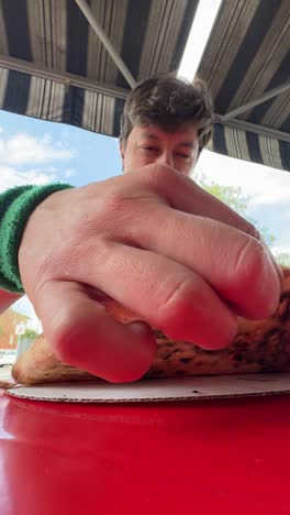 people enjoying pizza outdoors