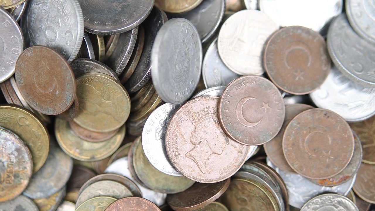 Close-up View of a Pile of Old and Foreign Coins