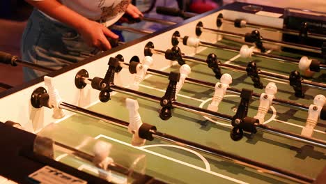 players engaged in a lively foosball match