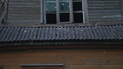 old abandoned house with boarded up windows.