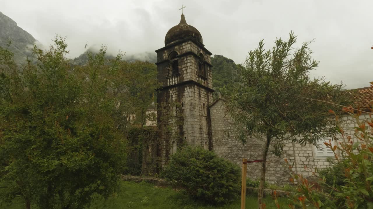 Aerial Look at Kotor Old Town and Castle Ruins in Montenegro During Spring