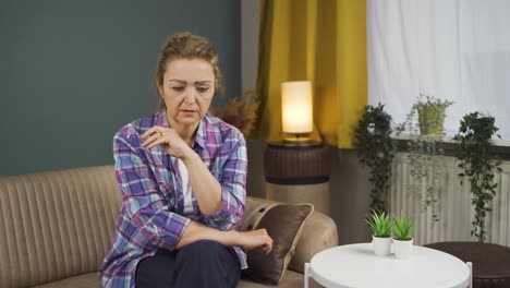 lonely woman thinks of her family.