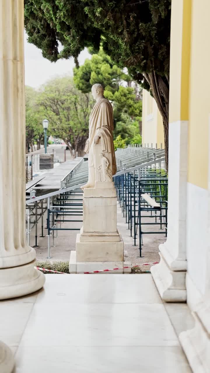 Classical Statue Framed by Columns at Zappeion Hall in Athens