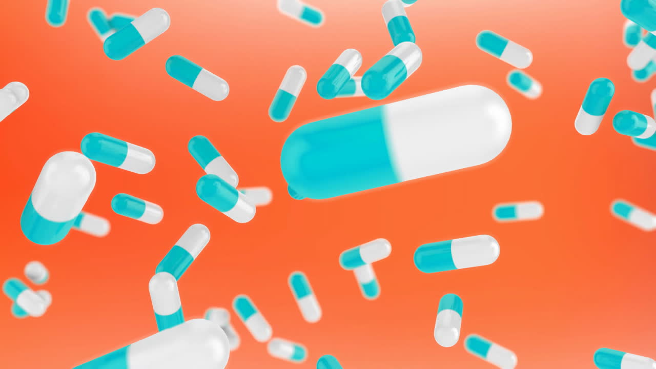 Animation of falling pills over red background