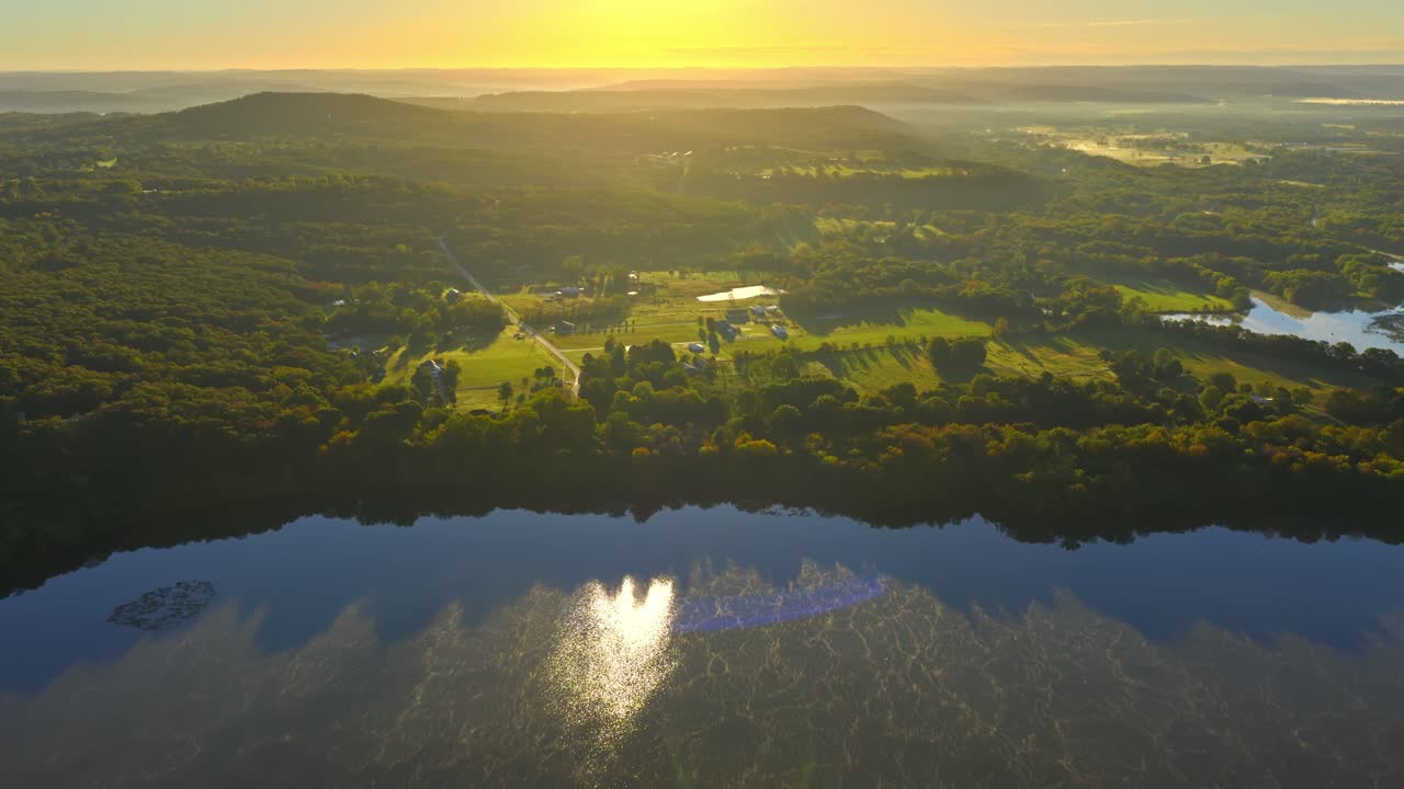 Sunset Reflected Over Lake Sequoyah, A Park And Reservoir In Arkansas, United States. Aerial Tilt-up Shot