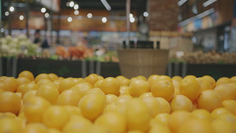 oranges on display at a grocery store
