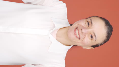 Vertical-video-of-Woman-clapping-excitedly-to-camera.