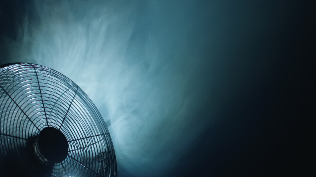 The fog is sucked in by the fan blades. The movement of air currents is visible