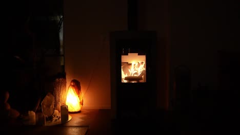 wood-burning fireplace with flames flickering in slow motion, creating a warm and cozy ambiance.