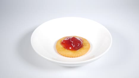 round crackers with strawberry jam
