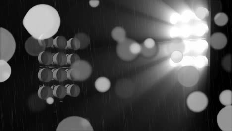 animation of glowing spots of light moving on dark background