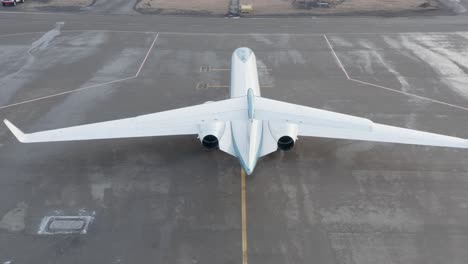 Aerial-of-Gulfstream-G550-business-jet-flying-towards-white-fuselage