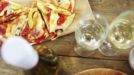 Delicious-pizza-with-a-glass-of-wine-and-spices