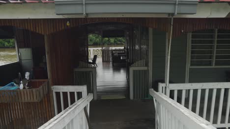 pov: walking in a house on the river in malaysia