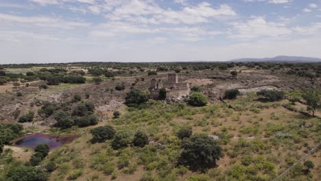 Aerial-view-circling-the-hilltop-castle-of-Mayoralgo-wilderness-in-Aldea-del-Cano-province-of-Cáceres