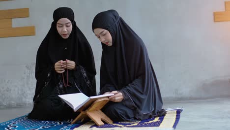 asian muslim woman praying and prostrating at home