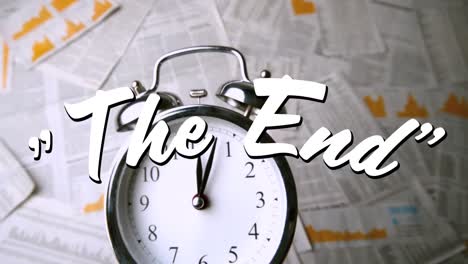 words the end are displayed on alarm clock in the background