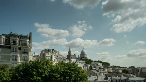 sacre coeur cathedral in paris with tourists on the steps