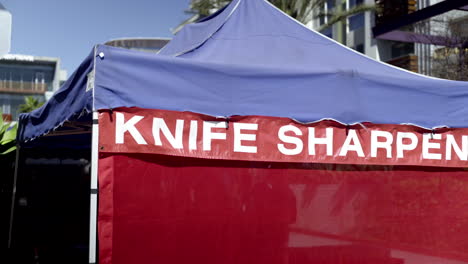 knife sharpening tent at an outdoor location