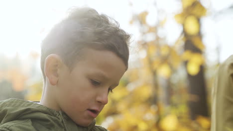 kid playing outdoors with his brother