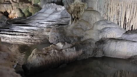 giant limestone underground cave with pure white stalactites and stalagmites