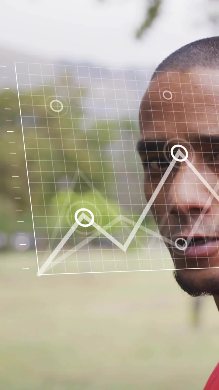 Vertical video: Man turning head causing HUD data with graphs morphing into bar charts for fitness