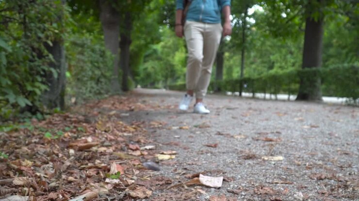 Male Torso walking towards camera in autumn park out of focus
