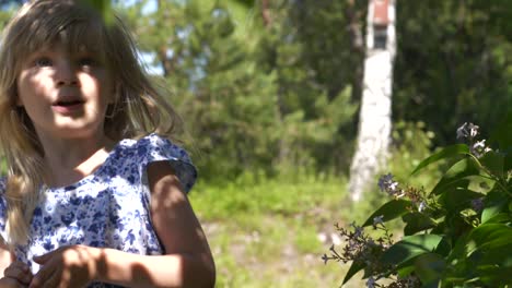 summer leaves casting shadows on happy girls face,slow motion,shallow depth of field