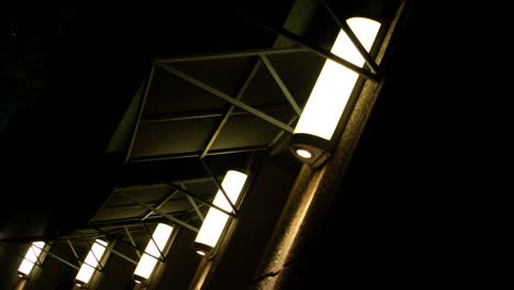 midtown city block at night with bright street lamps