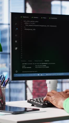 vertical video african american software developer does visual coding and creating software