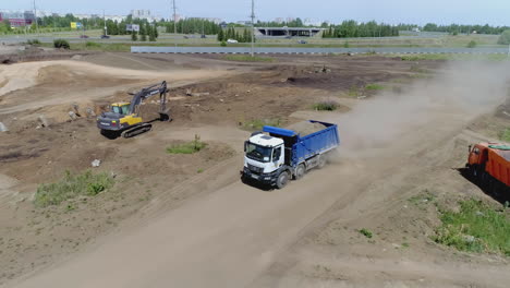 construction site with excavator and dump truck