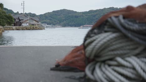 Ine-cho-in-Northern-Kyoto,-Rack-Focus-From-Coils-of-Rigging