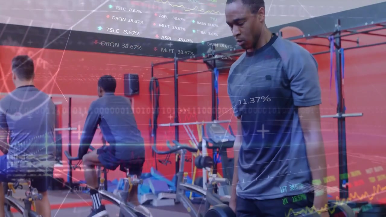 Male athlete holding dumbbells performing weighted step-ups on blue plyo box for circuit training