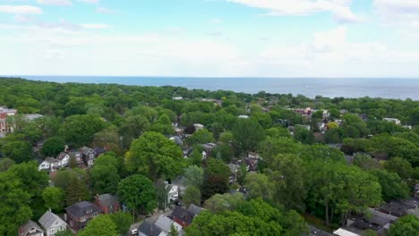 flying over toronto homes on a summer day near lake ontario