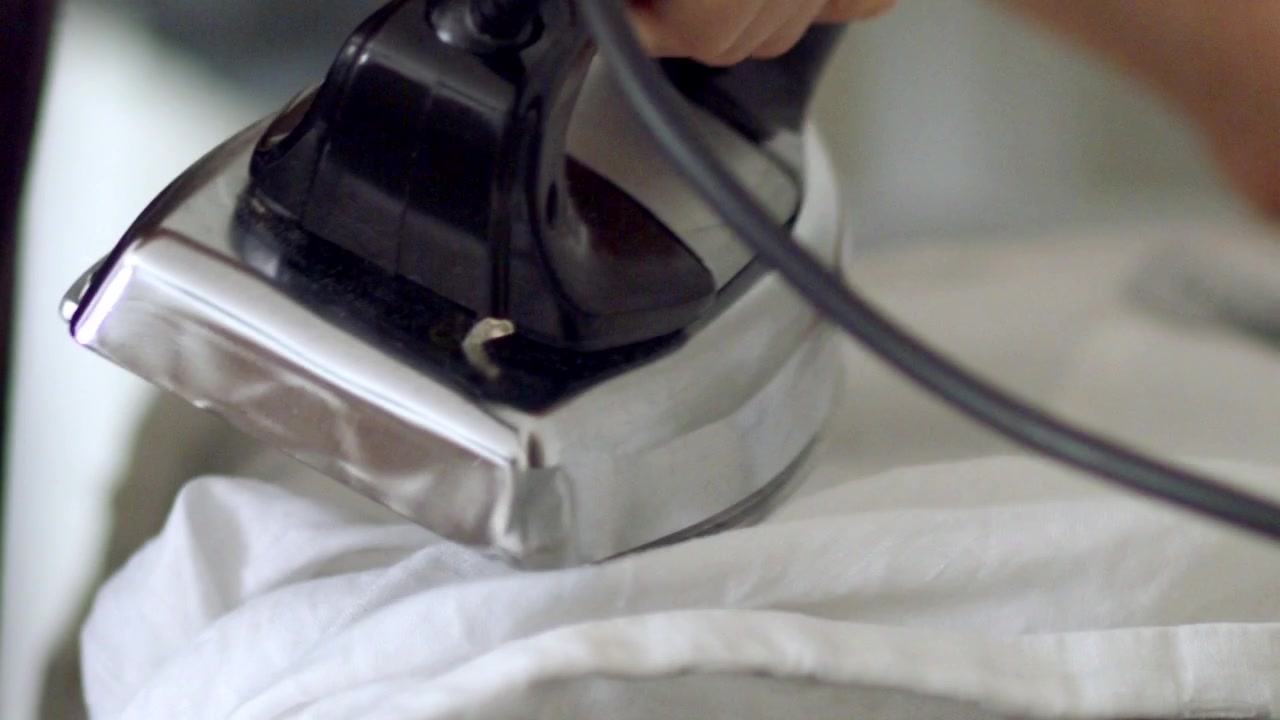 Preparing clothes, crisp and neat, ready to wear, a domestic feat