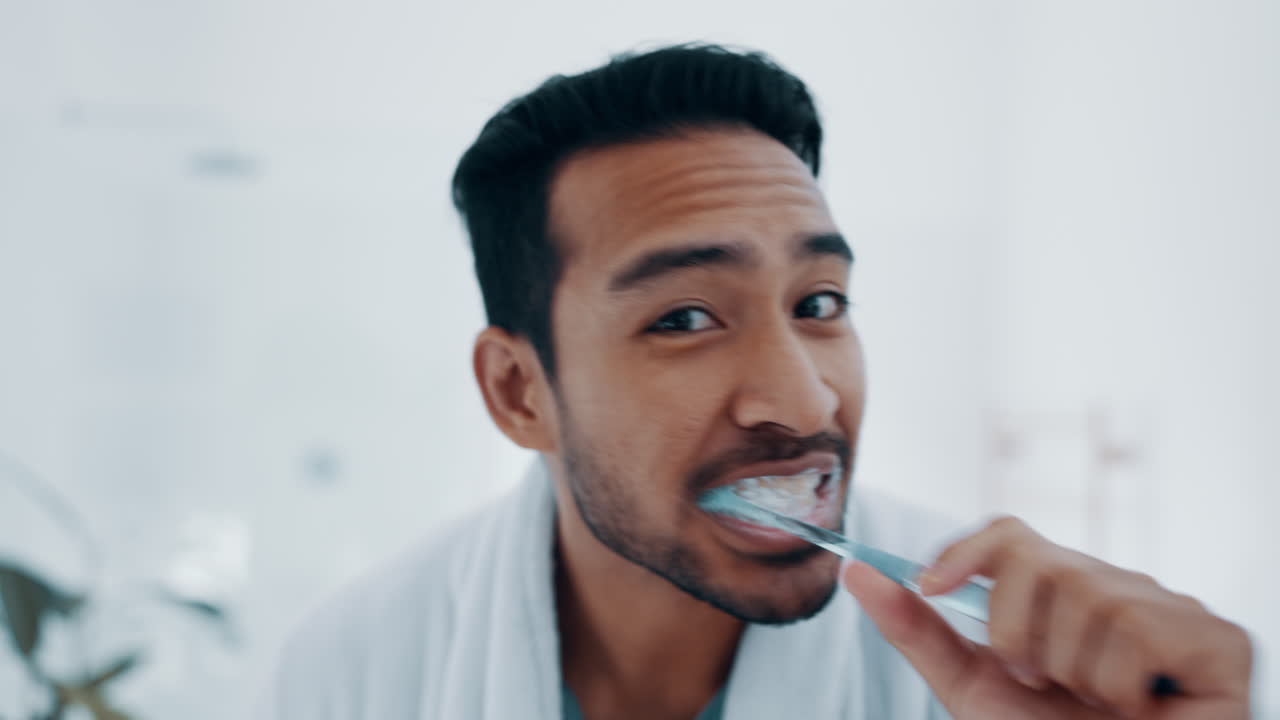 Face, man and brushing teeth in bathroom