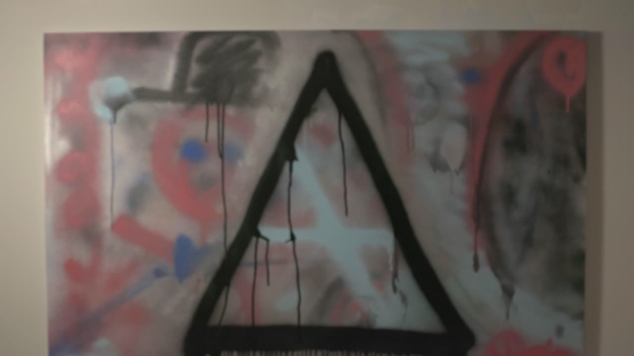 Man Looking At The Wall With Abstract Painting - Closeup Shot