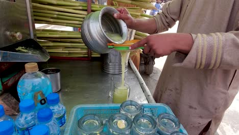 pouring fresh sugarcane juice