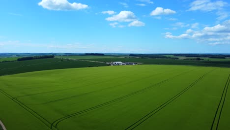 Beautiful-aerial-birds-eye-view-over-farmland-and-fields-in-Salisbury-Plains,-England