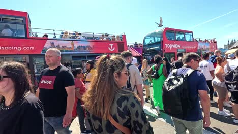 crowds gather near iconic london landmarks