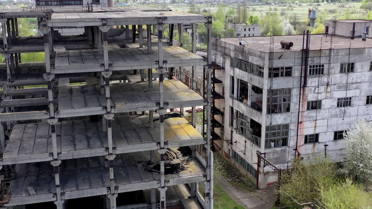 Old industrial buildings. Ruined factory buildings of industry. Empty abandoned place. Aged industrial edifices.