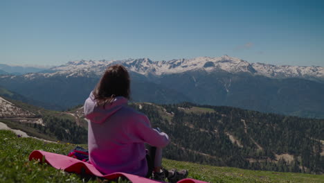 woman enjoying a scenic mountain view