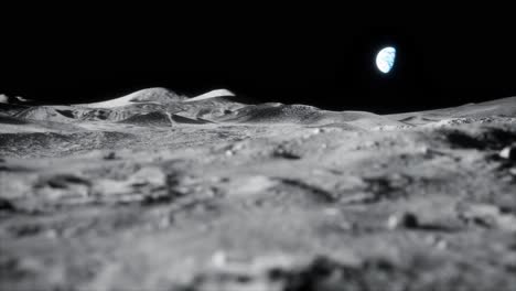 4k high detail close up focus rack sideways slider dolly shot of moon lunar landscape with earth just above horizon